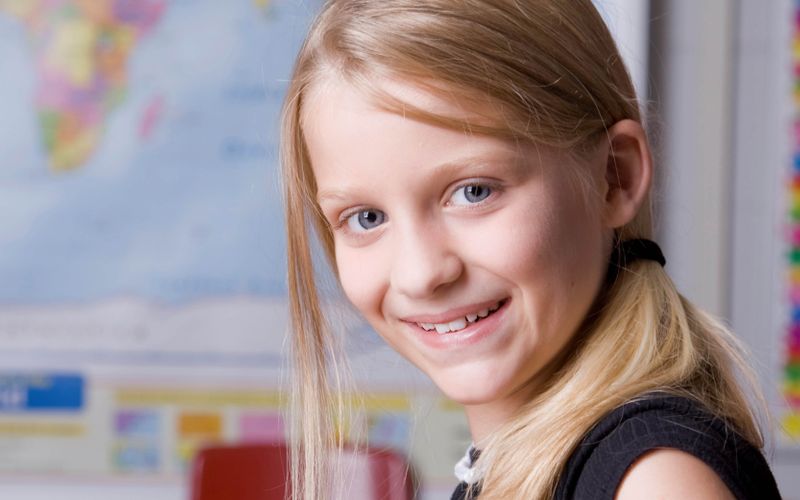 girl in front of map