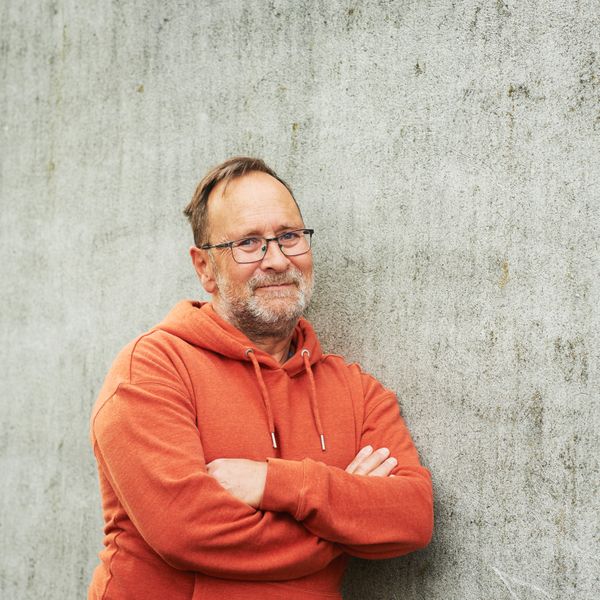 man in orange hoodie