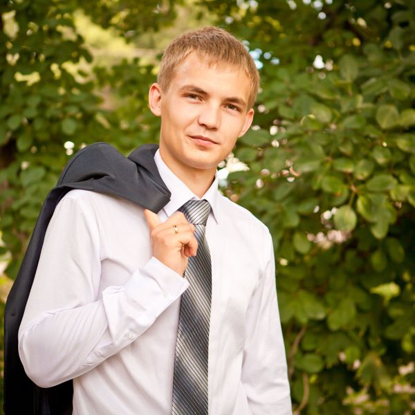 man with tie outdoors